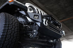 Close-up of DV8 Offroad 18-23 Jeep Wrangler JL / 20-23 Jeep Gladiator JT FS-7 Mid-Width Winch Front Bumper with winch and D-ring mounts.