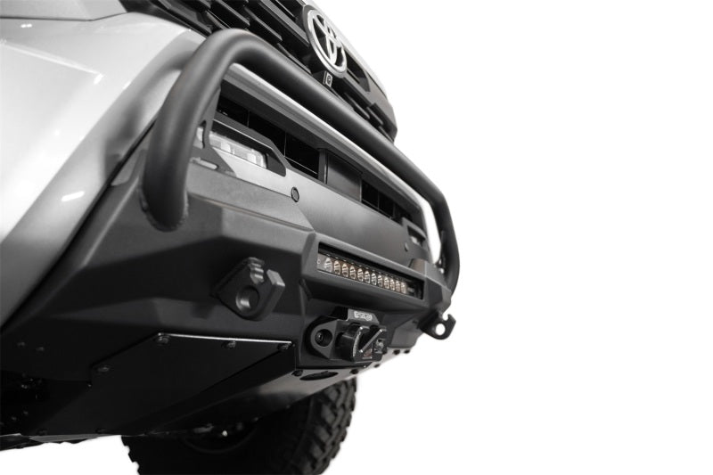Addictive Desert Designs2024+ Toyota Tacoma Stealth Center Mount Winch Front Bumper w/ Top Hoop close-up view with light bar