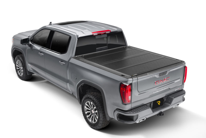 BAK 2020 Chevy Silverado 2500/3500 HD 6ft 9in Bed BAKFlip F1 hard folding truck bed cover on a GMC truck.