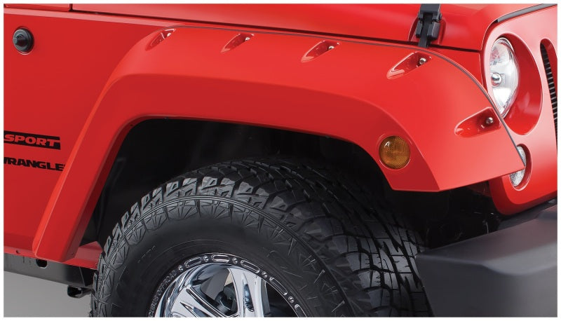 Bushwacker 07-18 Jeep Wrangler Pocket Style Flares 2pc - Black on red Jeep with off-road tires.