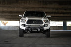 DV8 Offroad 2016+ Toyota Tacoma Center Bumper in parking garage