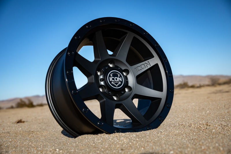 ICON Rebound 18x9 6x5.5 0mm Offset 5in BS 106.1mm Bore Double Black Wheel on desert sand.