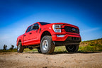 ICON 21-23 Ford F150 Tremor 2.5-3in 2.5 Series VS IR Coilover Kit installed on lifted red truck
