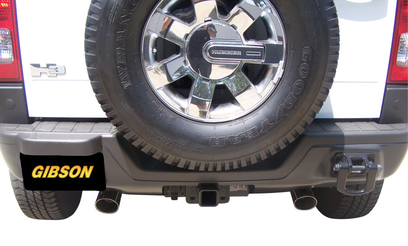 Gibson 07-10 Hummer H3 Base 3.7L 2.5in Cat-Back Dual Split Exhaust - Aluminized with dual tips and spare tire.