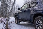 N-Fab Trail Slider Steps 10-20 Toyota 4Runner (Excl. 10-19 Limited / 10-13 SR5) - Textured Black on snowy trail
