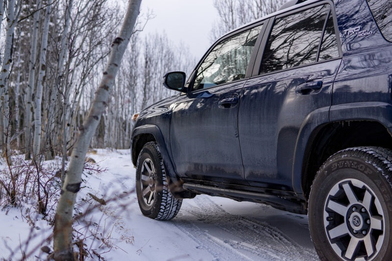 N-Fab Trail Slider Steps 10-20 Toyota 4Runner (Excl. 10-19 Limited / 10-13 SR5) - Textured Black on snowy trail