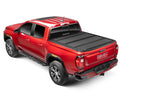 BAK 2024 Toyota Tacoma 6ft Bed BAKFlip MX4 Bed Cover on red truck