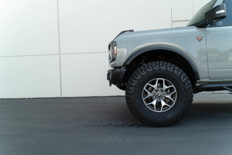 DV8 Offroad 21-23 Ford Bronco Capable Bumper Front License Plate Mount with offroad wheels