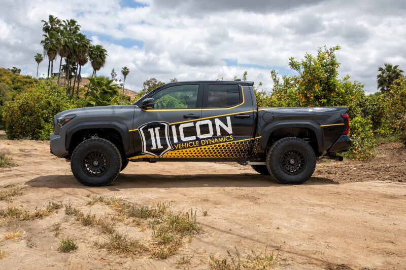 ICON 2024+ Tacoma .5in Lift Triple Rate Rear Coil Spring Kit on off-road terrain