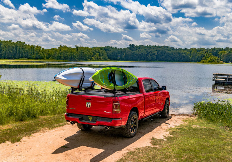 Retrax 07-18 Tundra CrewMax 5.5ft Bed with Deck Rail System RetraxPRO XR on truck with kayaks, perfect for offroad adventures.