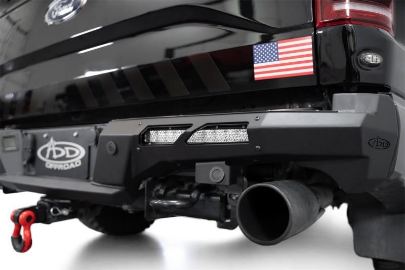 Addictive Desert Designs17-20 Ford F-150 Raptor Phantom Front Bumper with offroad lights and recovery gear.