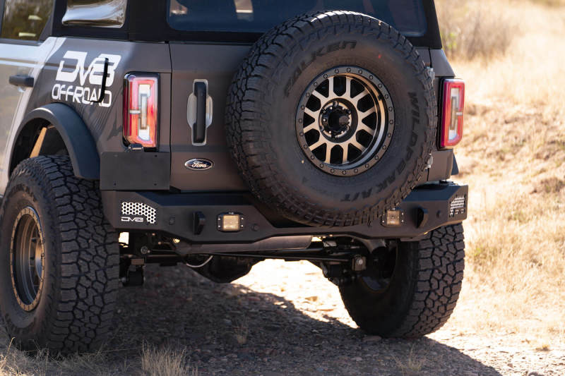 DV8 Offroad 21-22 Ford Bronco MTO Series Rear Bumper with offroad wheels and lighting.