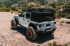 Body Armor 4x4 2018+ Jeep Wrangler Full Width Rear Bumper w/ Tire Carrier Mount on an off-road trail.