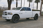 ICON 09-18 Ram 1500 4WD .75-2.5in Stage 4 Suspension System on lifted truck with offroad wheels.