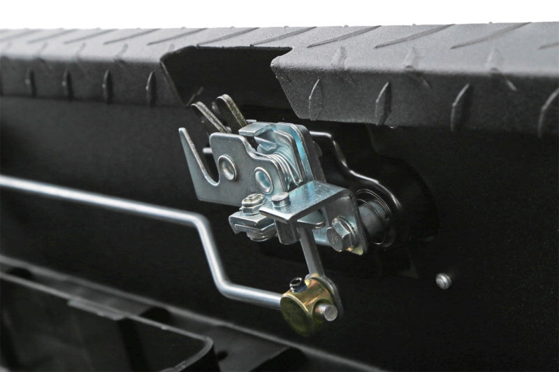 Deezee Universal Tool Box - Red Crossover - Single Lid Black BT Pull Handle (Low/Txt Blk) lock mechanism close-up.