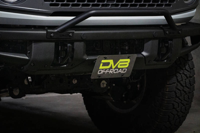 DV8 Offroad 21-22 Ford Bronco Factory Front Bumper Licence Relocation Bracket - Front on offroad vehicle
