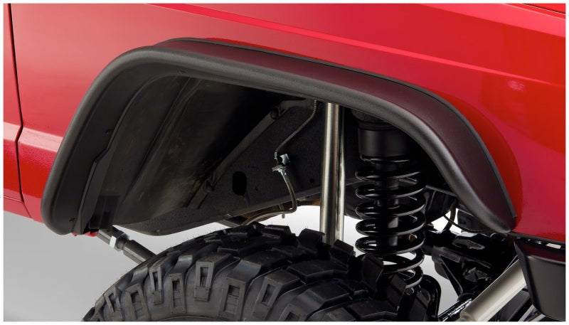 Bushwacker 84-01 Jeep Cherokee Flat Style Flares 2pc - Black detail on suspension system and tire