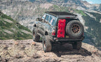 MagnaFlow 98-02 Toyota 4Runner Overland Series Cat Back Performance Exhaust on offroad vehicle with overland gear in scenic mountain view.