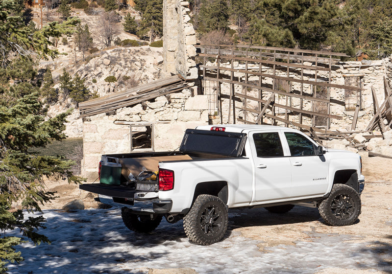 BAK 14-18 Chevy Silverado 1500 / 15-20 Chevy Silverado 2500/3500 6ft 6in Bed BAKFlip G2 on offroad terrain.