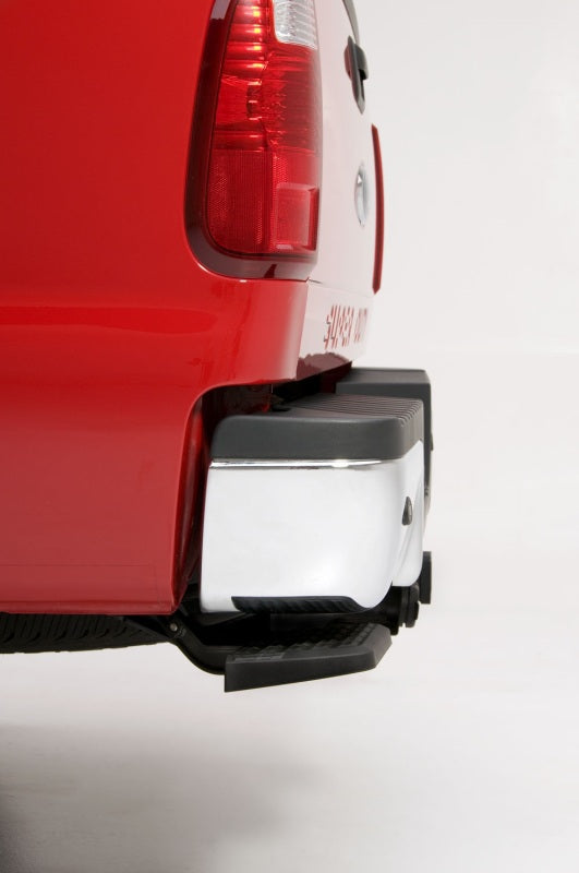AMP Research 1999-2016 Ford F-250/350/450 BedStep - Black installed on a red truck rear bumper.