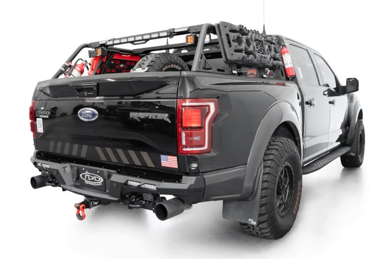 Addictive Desert Designs17-20 Ford F-150 Raptor Phantom Front Bumper on offroad truck with accessories.