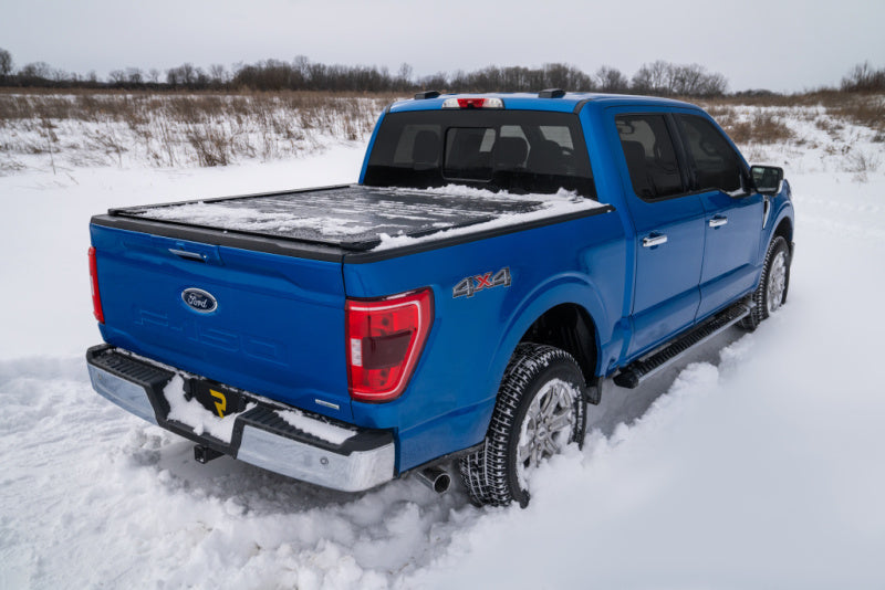 Retrax 21-22 Ford F-150 Super Crew/Super Cab (Incl. 2022 Lightning) 5.5ft Bed RetraxPRO XR on snowy terrain.