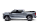 BAK 19-21 Chevy Silverado/GM Sierra Revolver X4s 5.10ft Bed Cover (New Body Style) on a silver truck with offroad tires.