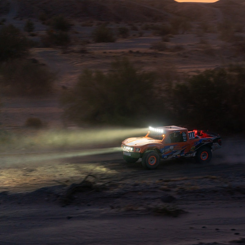 Rigid Industries 360-Series Laser 6in Amber Backlight on off-road truck, enhancing visibility and performance in rugged conditions.