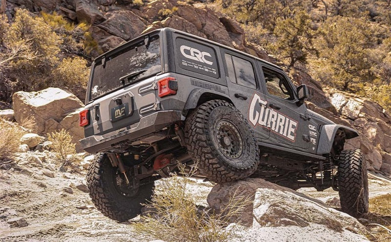 MagnaFlow 2020 Jeep Gladiator 2.5in Rock Crawler Series Single Rear Exit SS Cat-Back Exhaust w/o Tip on rocky terrain.