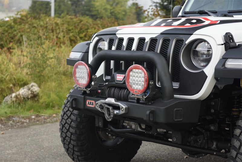 ARB Bar Jl T/Stubby with winch, offroad lights, and rugged tires
