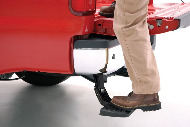 AMP Research 19-22 Ram 1500 (Excludes TRX Model) DT BedStep - Black in use on a red truck.