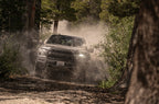 Fox Ford Raptor 3.0 Factory Series 12.3in External QAB P/B External Cooler Shock Set in off-road terrain