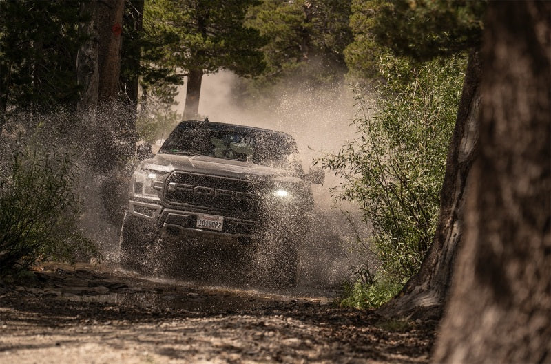 Fox Ford Raptor 3.0 Factory Series 12.3in External QAB P/B External Cooler Shock Set in off-road terrain