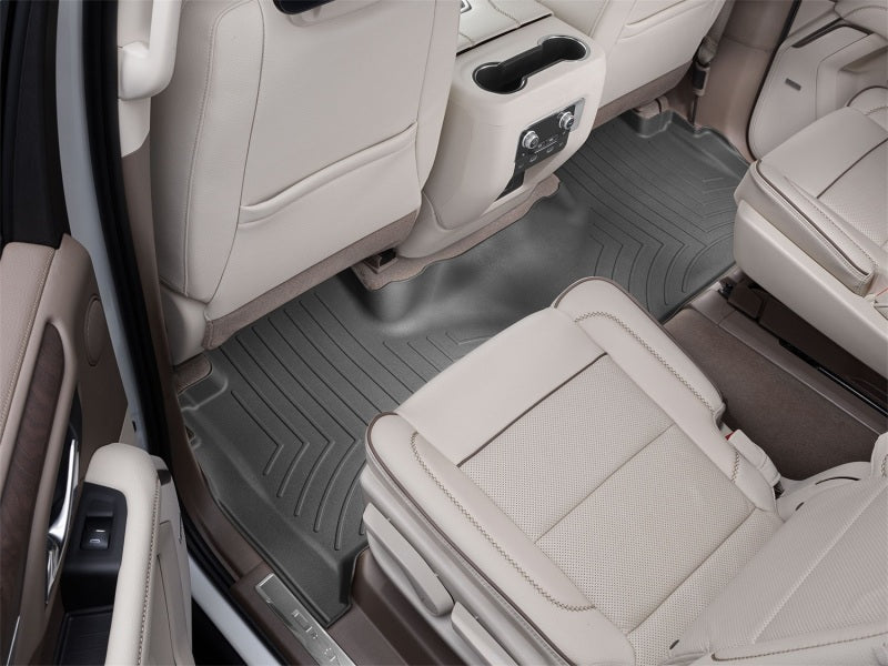 WeatherTech 2021+ Cadillac Escalade Rear FloorLiner - Black on tan interior.