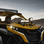 Baja Designs Can-Am Maverick R Clear 10in OnX6+ Shock Tower Kit mounted on ATV