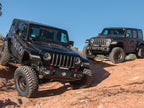 ICON 2018+ Jeep Wrangler JL 2.5in Stage 1 Suspension System in off-road setting, showcasing offroad performance upgrades.