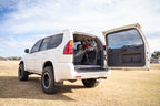 DV8 Offroad 03-09 Lexus GX 470 Rear Window Molle Storage Panels in an SUV's rear door.