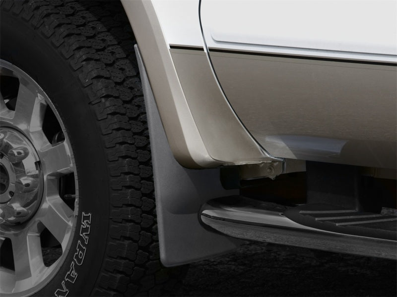 WeatherTech 08-10 Ford F250/F350 No Drill Mudflaps - Black mounted on truck