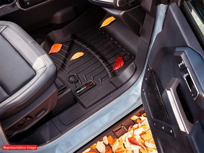 WeatherTech 2017+ Ford F-250/F-350/F-450/F-550 Crew Cab Rear FloorLiner - Black in vehicle with autumn leaves