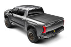 Retrax 2024 Ford F-150 SuperCrew/Super Cab 5.5ft. Bed Retrax EQ on a truck with offroad wheels and tires.