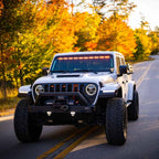 KC HiLiTES FLEX ERA 3 Dual Mode SAE Fog Lights - 2-Light Master Kit on Jeep Wrangler with offroad wheels and lighting.