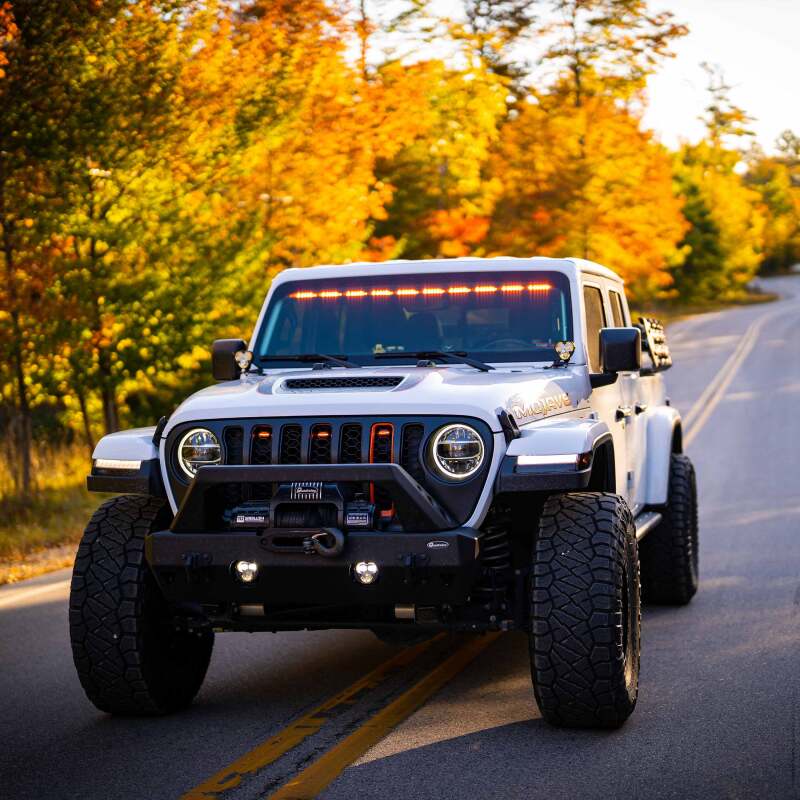 KC HiLiTES FLEX ERA 3 Dual Mode SAE Fog Lights - 2-Light Master Kit on Jeep Wrangler with offroad wheels and lighting.