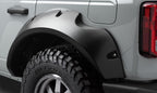 Bushwacker 2021+ Ford Bronco 4-Door Pocket Style Flares 4pc - Black on off-road tires for performance upgrades.