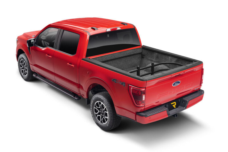 AMP Research 04-22 Ford F-150 Bedxtender HD Max - Black on red truck