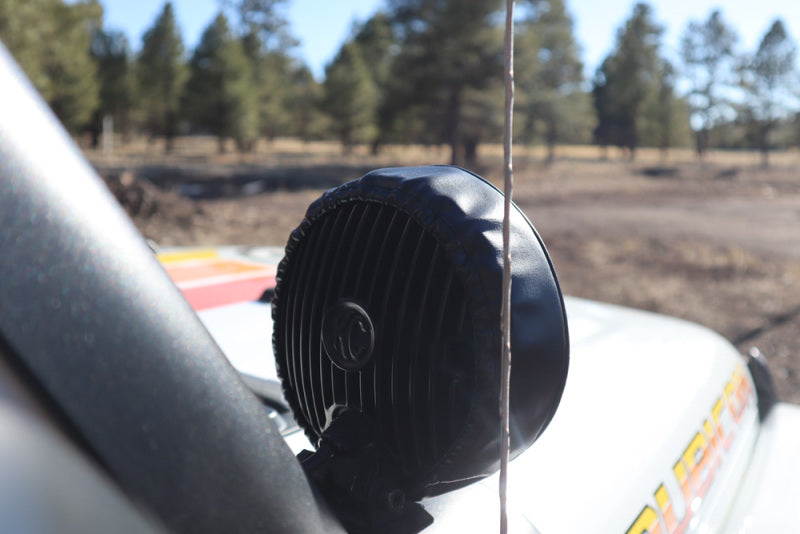 KC HiLiTES 6in. Round Soft Cover (Pair) - Black w/Yellow KC Logo on off-road vehicle