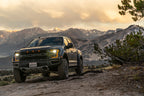 FOX Factory Race Series GEN2 2in. Universal Front Bump Stop IFP on offroad terrain with mountains in the background.