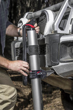 Person using ARB Hydraulic Recovery Jack for off road recovery.