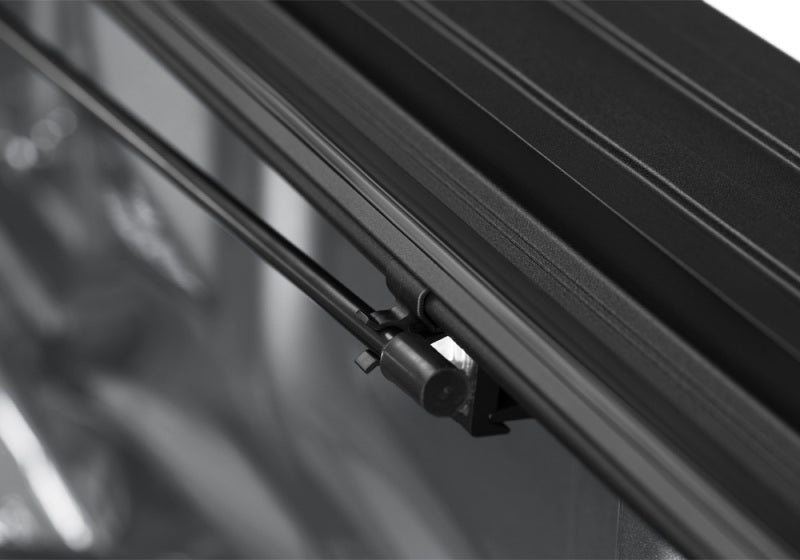 Close-up of BAK 15-20 Ford F-150 8ft Bed BAKFlip MX4 Matte Finish hardware and mechanism.