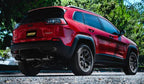 Gibson 14-20 Jeep Cherokee 3.2L 2.5in/2.25in Cat-Back Dual Split Exhaust - Stainless installed on a red SUV.