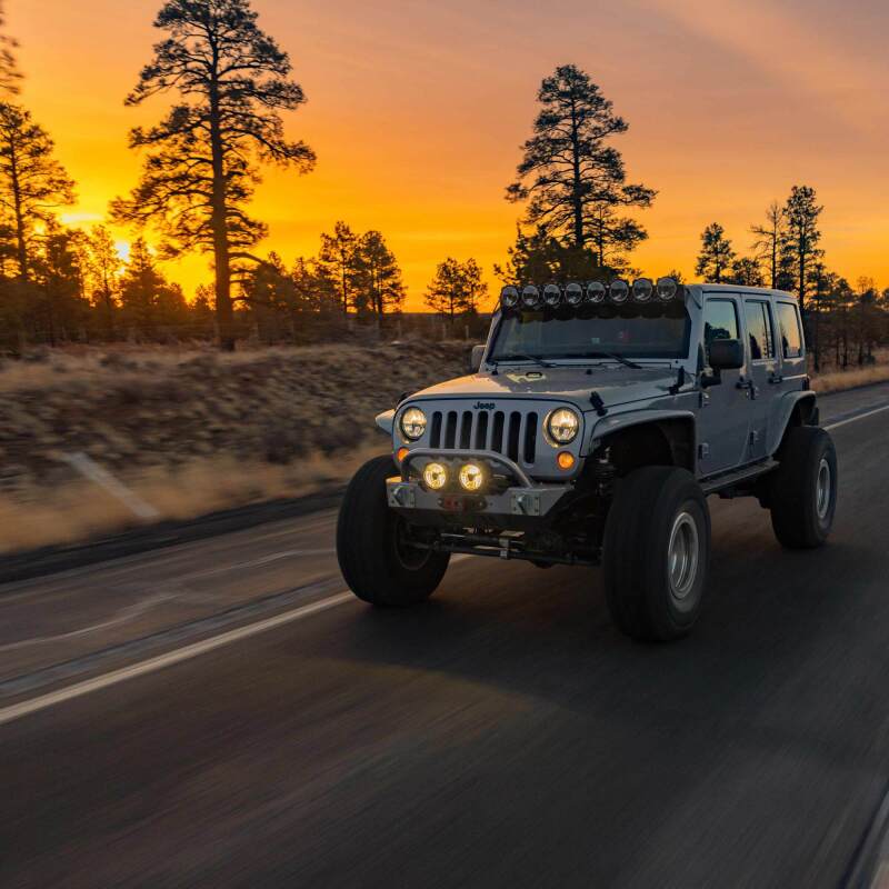 KC HiLiTES Gravity Titan LED 6in. - Pair Pack (SAE Driving Beam) on Jeep driving at sunset